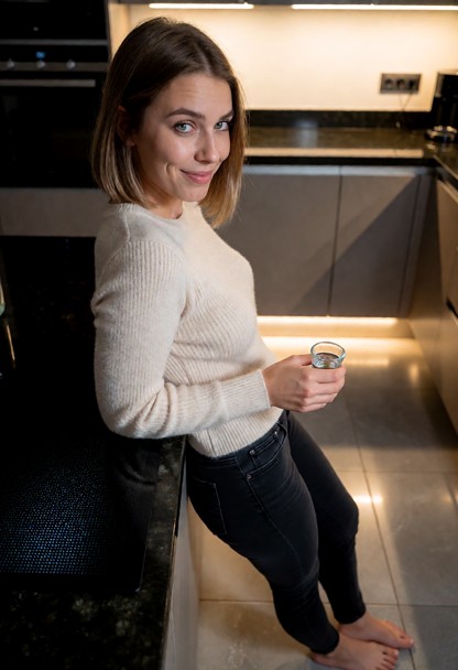 Location: evening in a modern kitchen with polished dark granite countertops, soft ambient light from under-cabinet L…