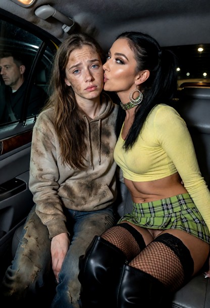 the subject is dressed in a filthy hoody and filthy jeans. Her hair is long and brown with filth. her face is also di…