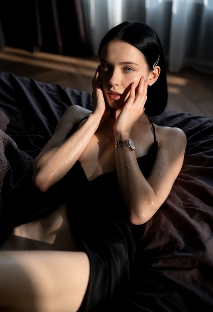 Location: dimly lit bedroom in the late afternoon with soft light filtering through the window, casting long shadows …