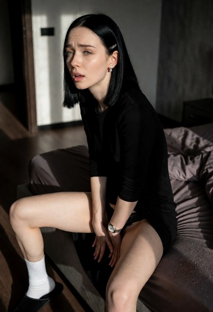 Location: dimly lit bedroom in the late afternoon with soft light filtering through the cracks of the door, casting l…