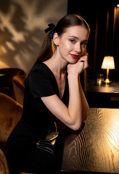 Location: evening inside a dimly lit restaurant with golden pools of light falling across dark wooden tables and plus…