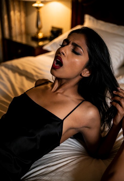 Location: late night in a luxurious hotel bedroom with soft amber lamplight reflecting off dark wood furniture and pl…