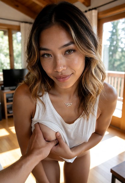 Brooklynn is leaning in close to the viewer. She grins confidently and uses her hand to guide the viewer's hand again…
